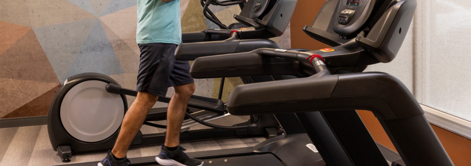 Man on treadmill in the hotel gym